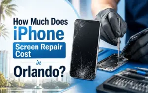 Technician inspecting a cracked iPhone screen for repair in Orlando